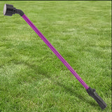 Berry purple 16-inch Dramm One Touch Rainwand with black nozzle and handle on green grass.