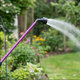 Berry Dramm One Touch Rainwand 16in, aluminum watering wand spraying water in a garden.